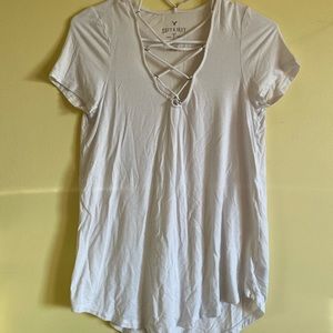 White shirt with holes by the neck